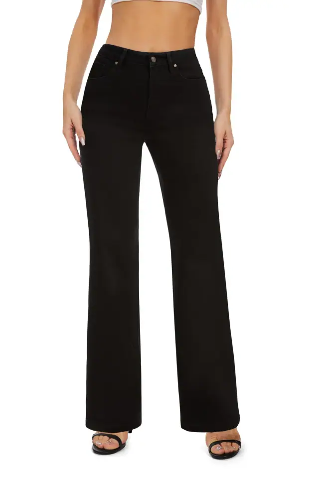 Black high-waisted wide-leg jeans with a relaxed straight drape and open-toe shoes.